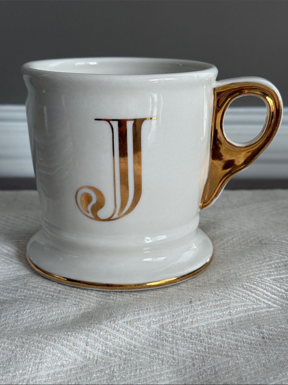 Anthropologie “J” Cream and gold monogrammed initial mug.